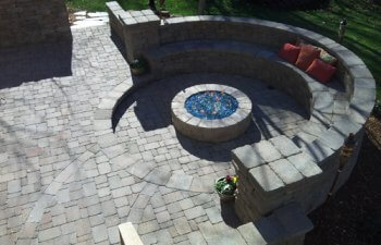 Stone patio with a fireplace