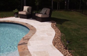 Stone patio by the pool in the garden