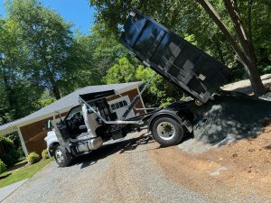 the loader is dumping soil