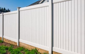 wooden white fence with green lawn