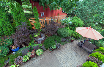 backyard garden landscaping with paver bricks patio